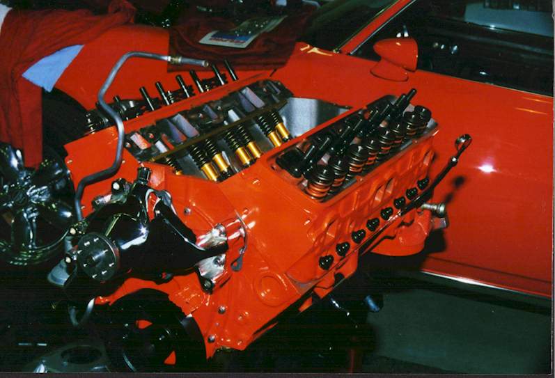 the partially assembled engine and the Camaro
